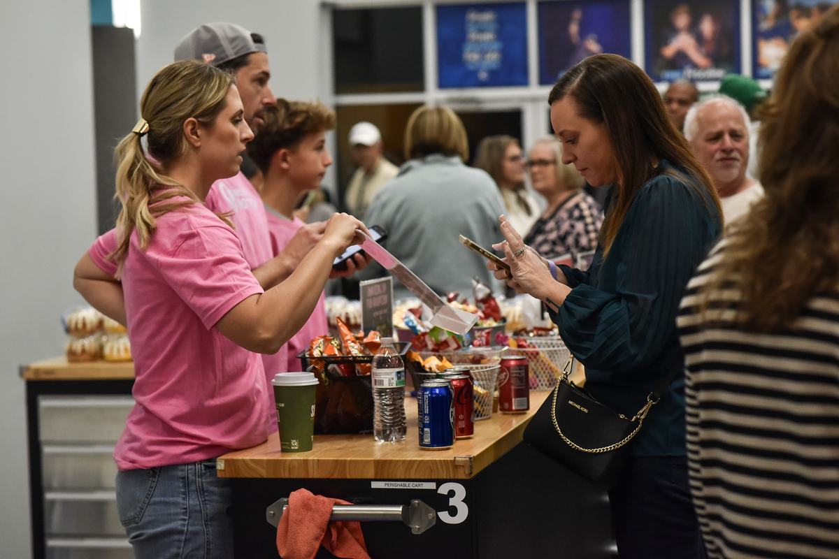 Volunteers serving snacks in the lobby
