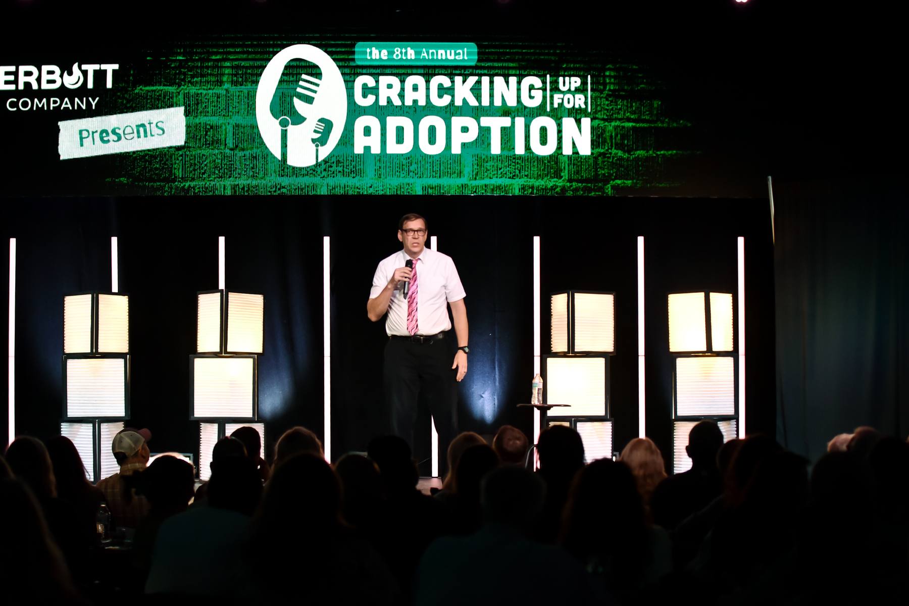 Comedian on stage at the 8th Annual Cracking Up for Adoption